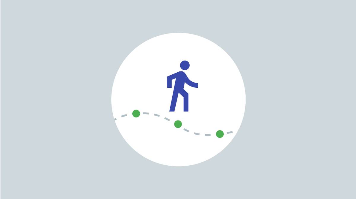 A blue man walking on green dots